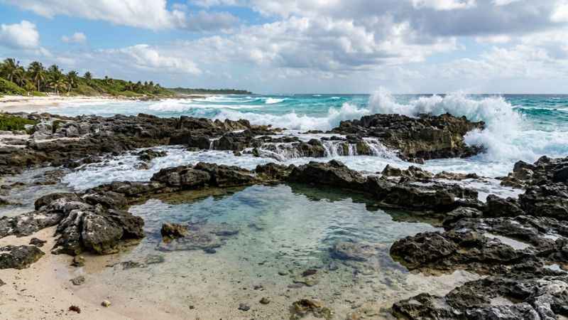 natural tide pools and turquoise ocean waves at chen rio cozumel