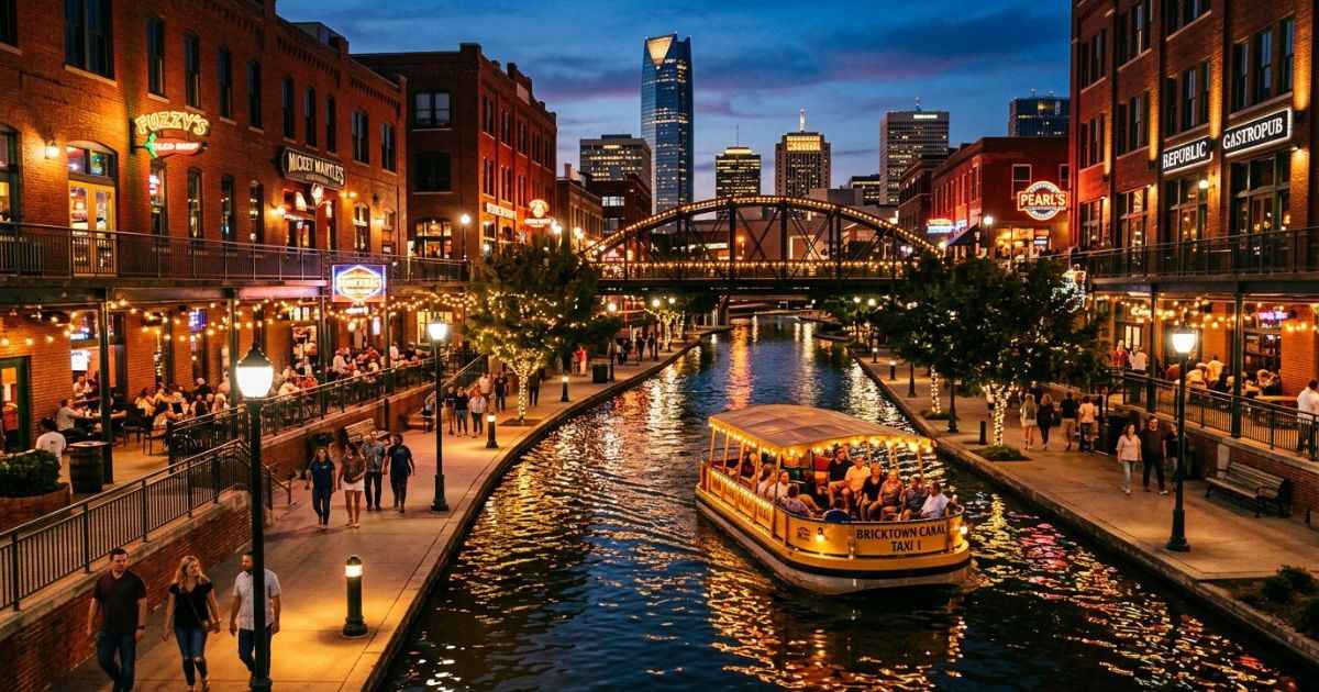 Bricktown Canal with water taxi and lights in downtown Oklahoma City