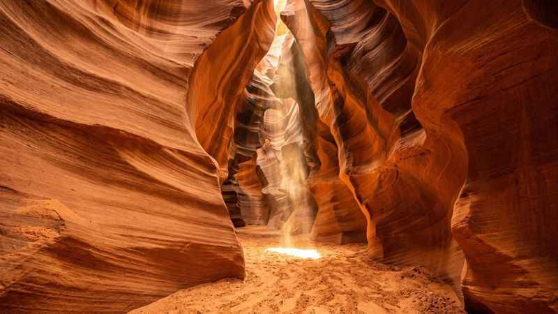 Sunlight shining down into the narrow, winding passageway of Antelope Canyon near Page.