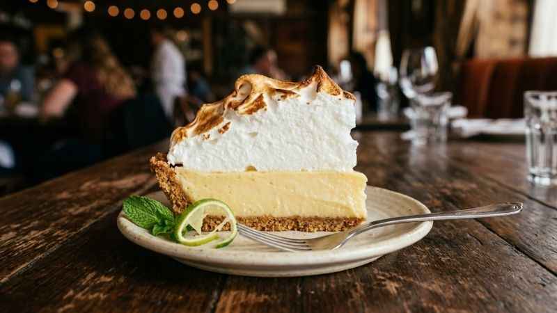 A delicious slice of traditional Key lime pie topped with fluffy meringue served at a local Key West restaurant.