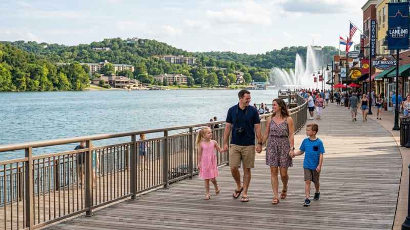 Visitors walking along the waterfront shops and restaurants at Branson Landing.