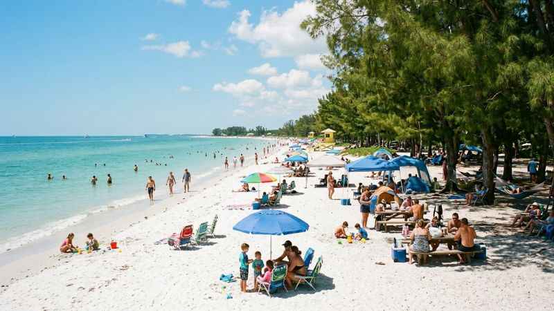 Visitors enjoying the shoreline and park facilities at Coquina Beach.