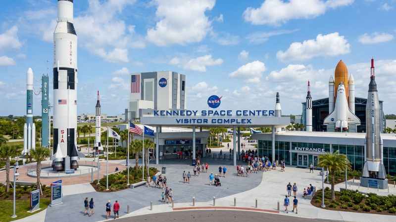 NASA globe sign and rocket exhibits at the Kennedy Space Center Visitor Complex near Orlando.