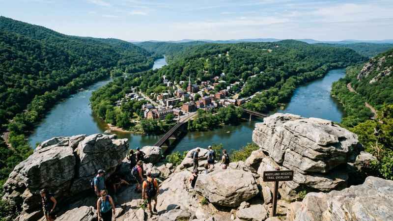 Panoramic view of Harpers Ferry town, the railway bridge, and river gap as seen from the rocky summit of the Maryland Heights Trail.