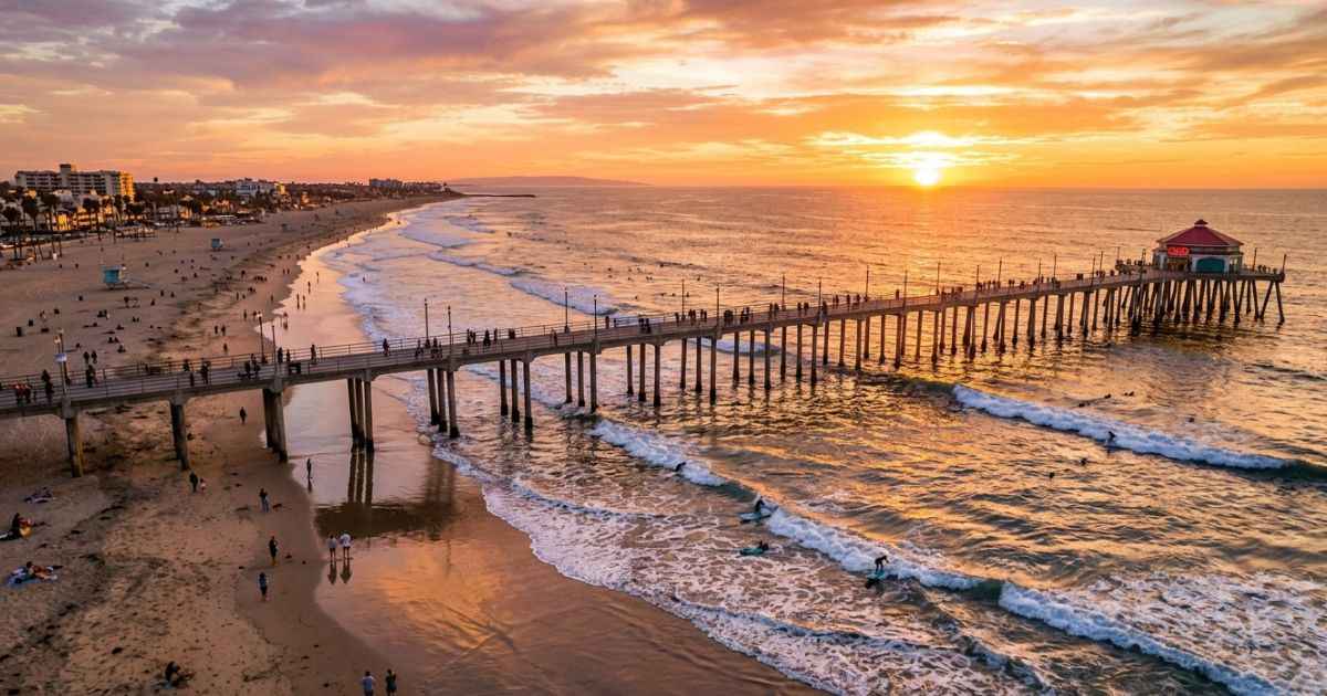 Aerial view of the Huntington Beach Pier at sunset in Surf City USA.