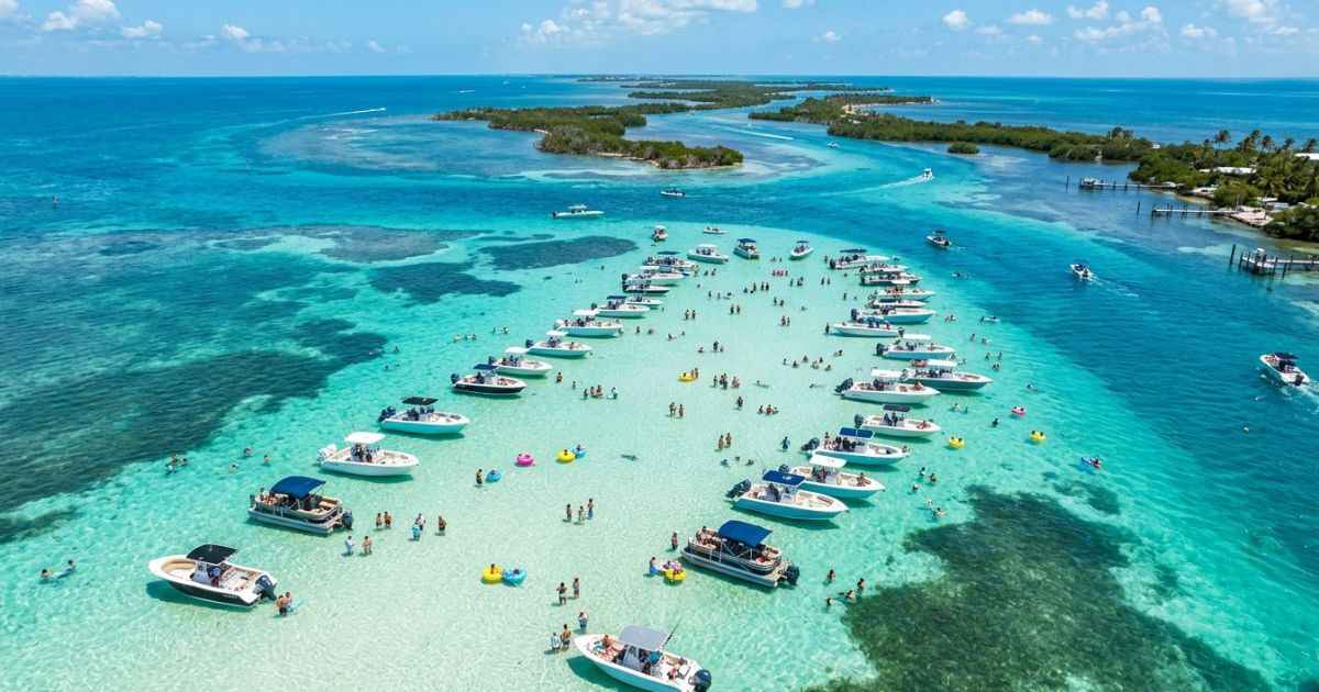 Aerial view of turquoise water and boats at the Islamorada sandbar in the Florida Keys.