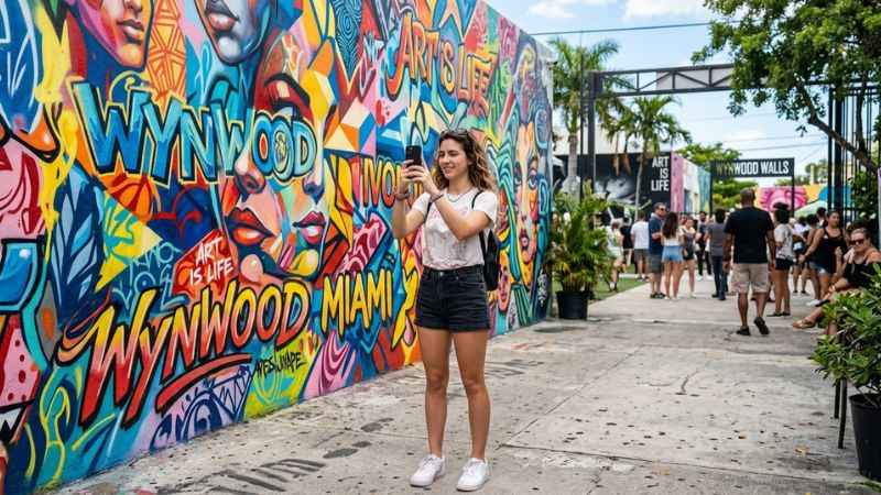 Large street art mural on display at Wynwood Walls in Miami.